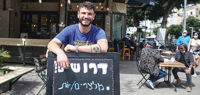 מסעדה הזקוקה לידיים עובדות בתל אביב // צילום: עופר וקנין, 'הארץ'