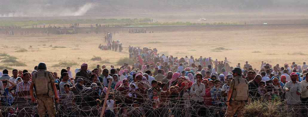 פליטים סורים על גבול טורקיה צילום Halil Fidan, Anadolu Agency, Getty Images